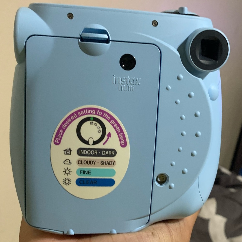 Light blue Polaroid camera and matching photo book to them the memories in.